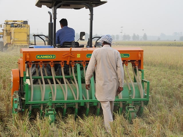 Direct sowing of wheat seed into a recently-harvested rice field using the “Happy Seeder” implement, a cost-effective and eco-friendly alternative to burning rice straw, in northern India. (Photo: BISA/Love Kumar Singh)